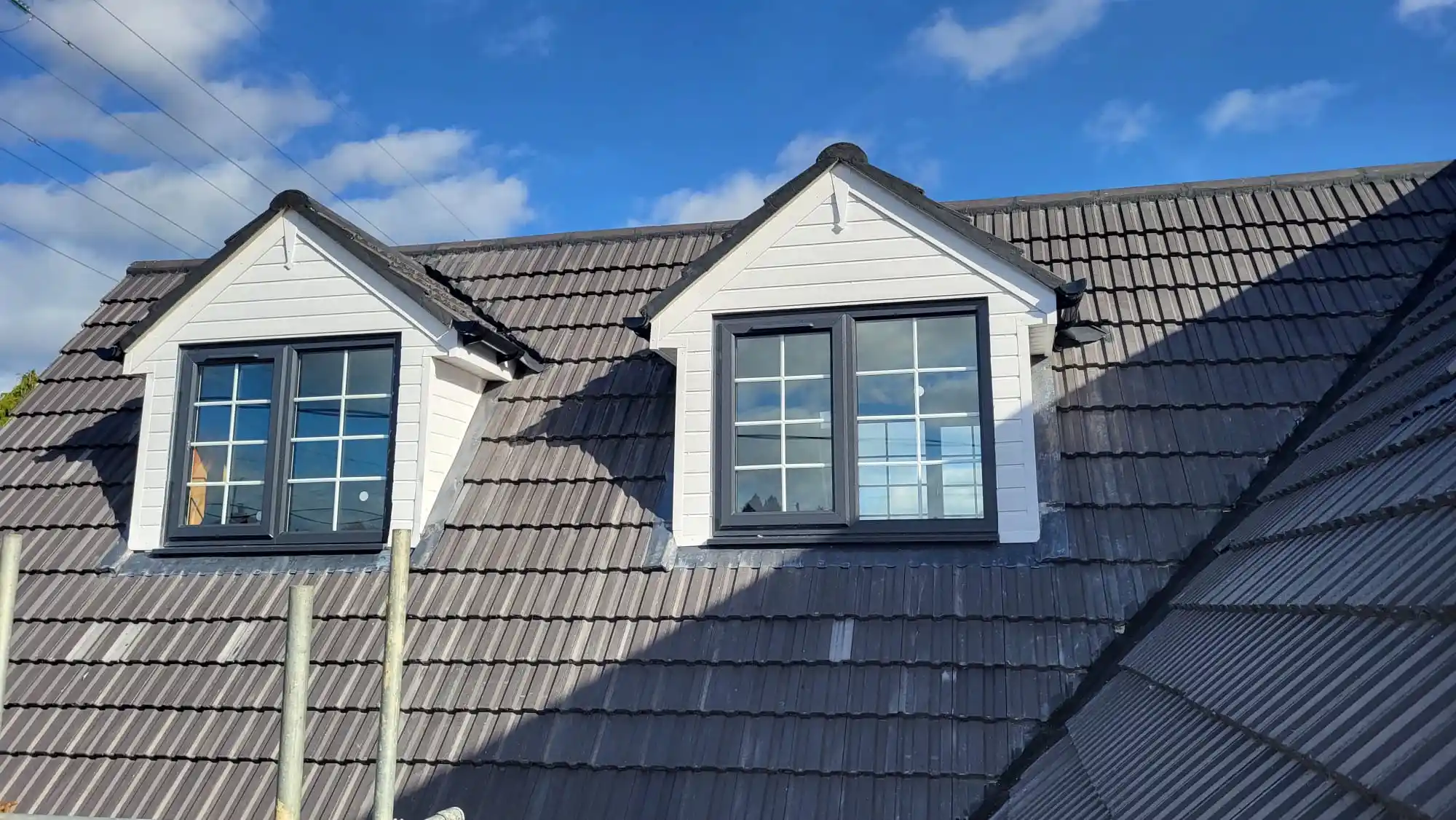 Pair of grey dormer windows installed by Bucks Glazing