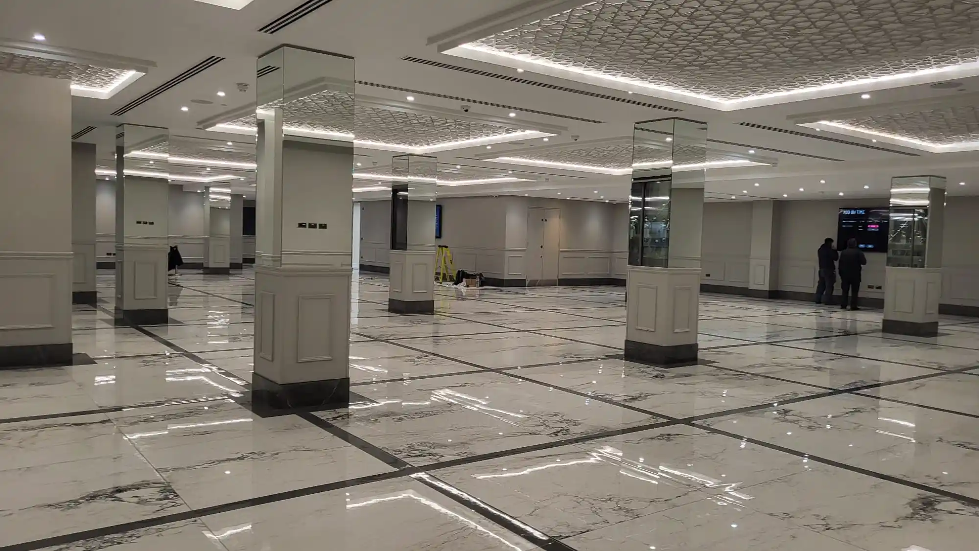 Commercial mirror-clad columns in large venue by Bucks Glazing