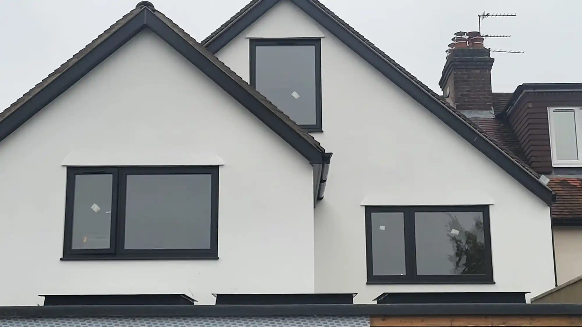 Anthracite grey casement windows on a modern house by Bucks Glazing