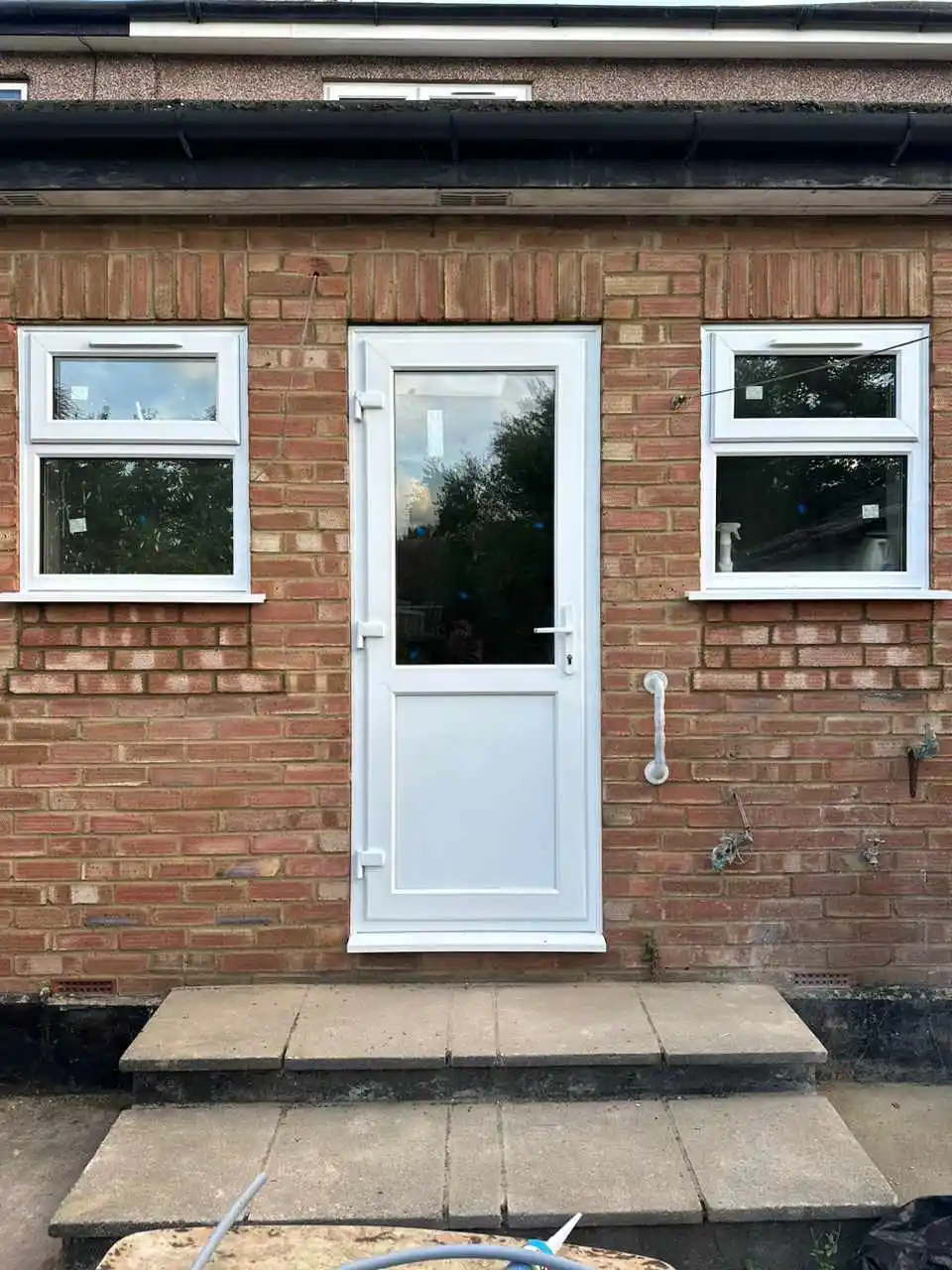 White UPVC back door with matching casement windows by Bucks Glazing
