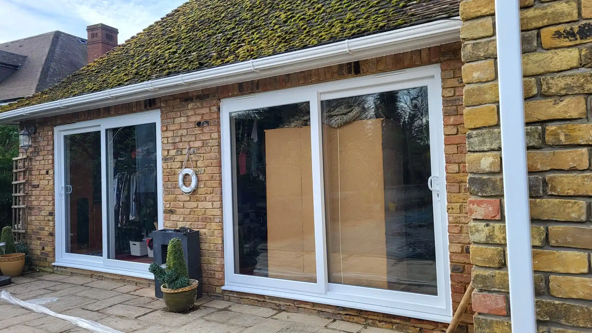 UPVC sliding patio doors on a brick cottage by Bucks Glazing